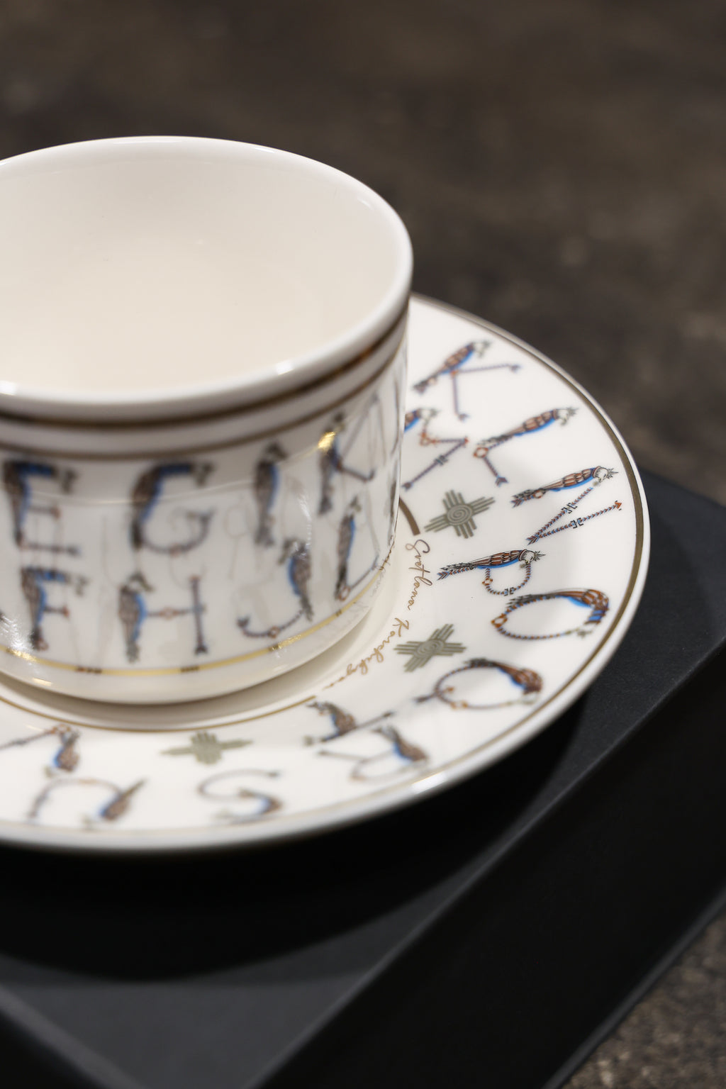 English Alphabet  — 24K Gold Porcelain Tea Cup & Saucer by KARCHIKYAN