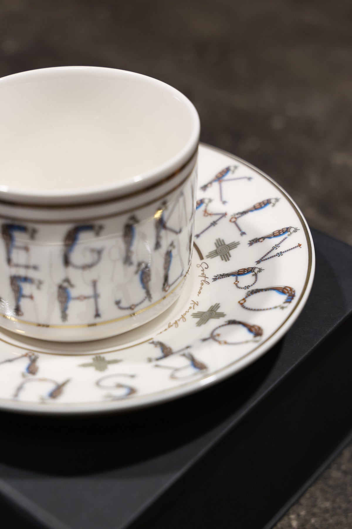 English Alphabet  — 24K Gold Porcelain Tea Cup & Saucer by KARCHIKYAN