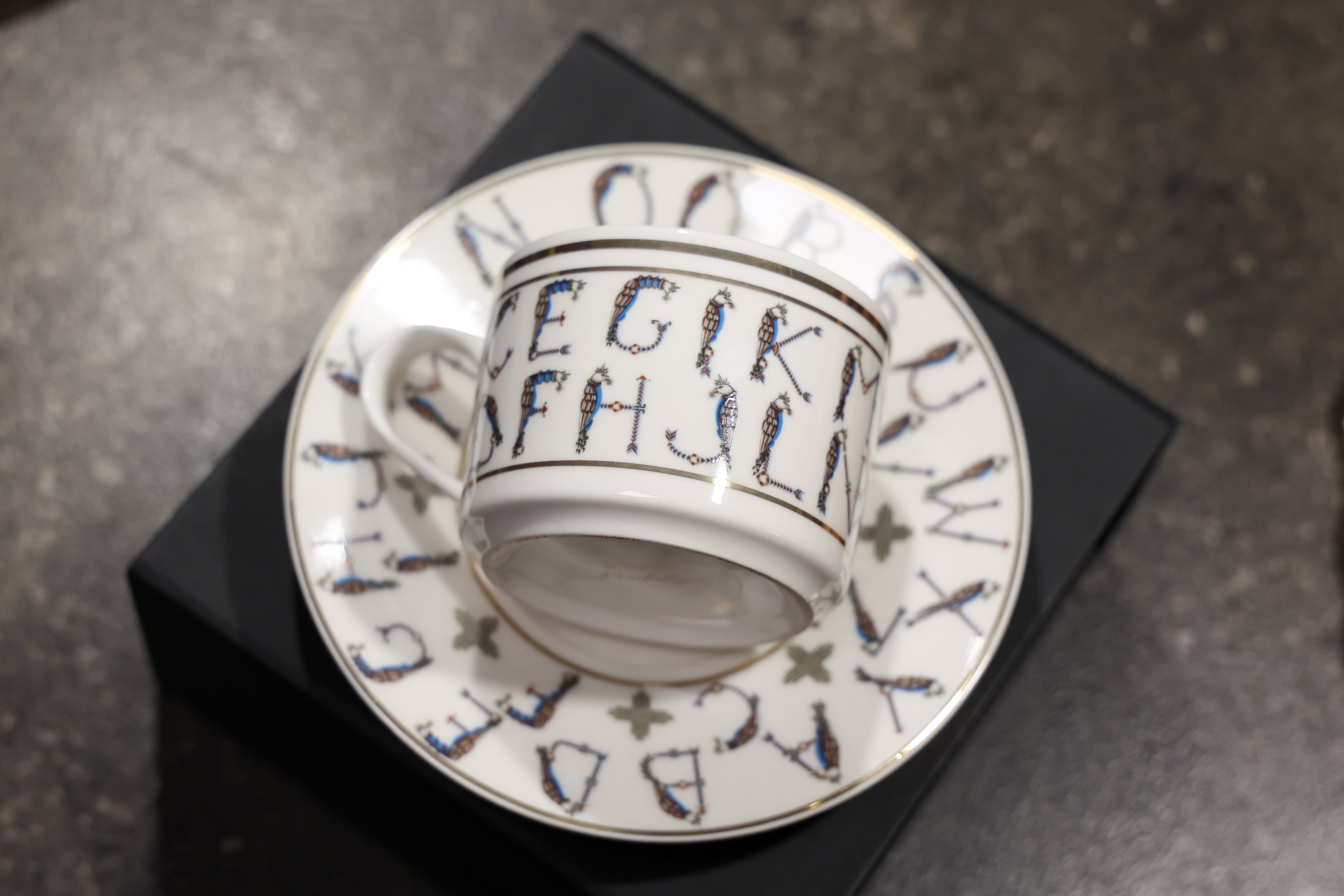 English Alphabet  — 24K Gold Porcelain Tea Cup & Saucer by KARCHIKYAN